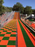 TUBING RIDES von OSTACON - In bunten Reifenschläuchen sitzend auf mobilen Rutschbahnen