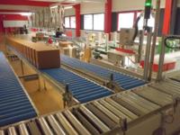KSL staubtechnik optimiert Abfüll- und Verpackungsprozesse mit AMI Förder- und Lagertechnik
