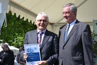 ZIM-Preis 2013 für VITRONIC: Bundesministerium für Wirtschaft und Technologie gratuliert Firmeninhaber Dr.-Ing. Norbert Stein
