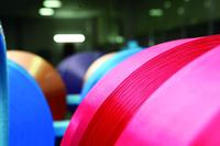 Spun-dyed polyester microfiber yarns with EvoQuench
