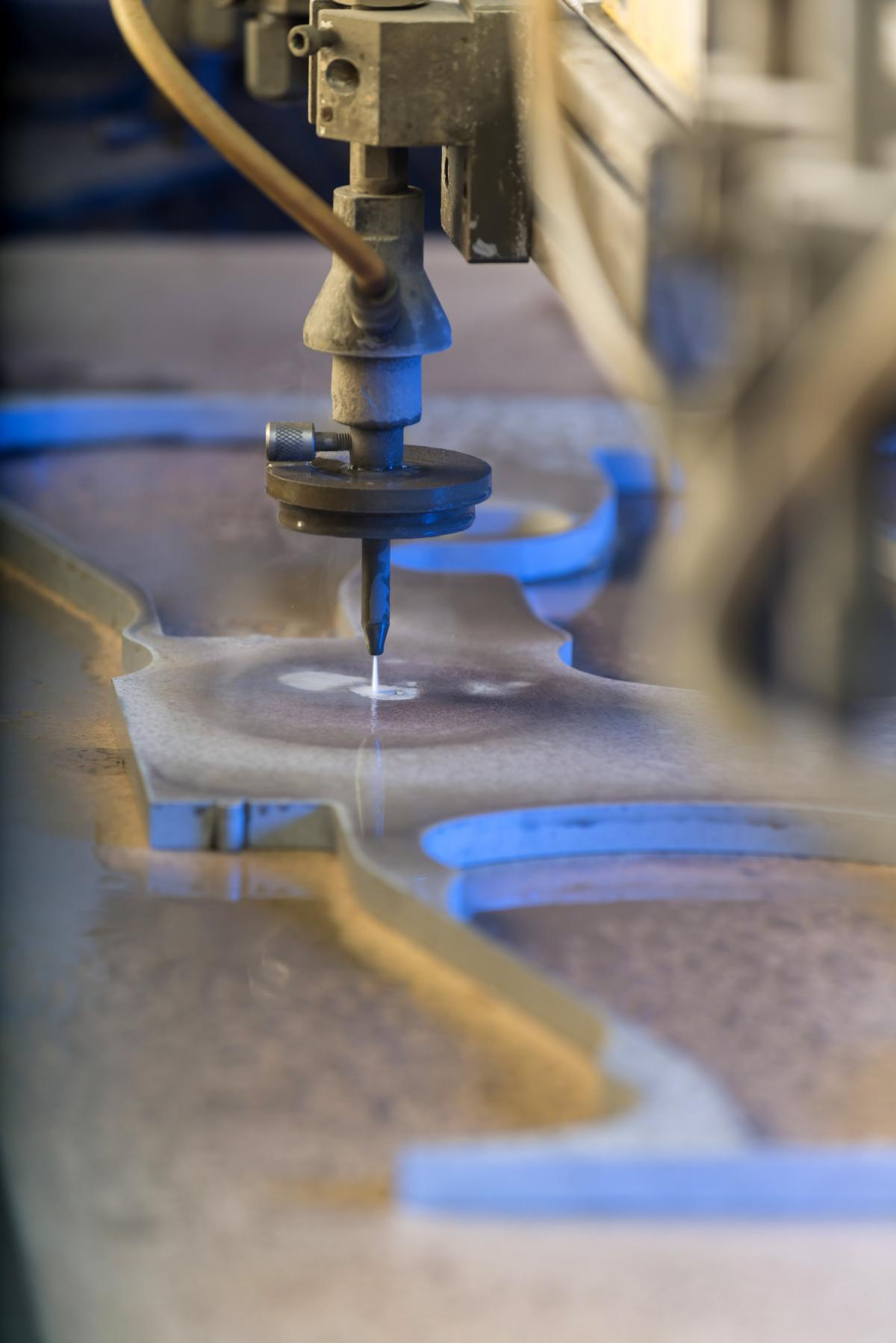 New highpressure pump for waterjet cutting combines high efficiency