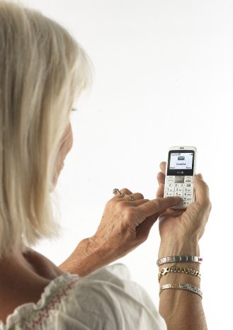 Lady with Doro PhoneEasy 332gsm white.JPG