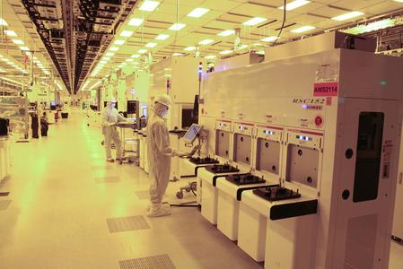Workers prep Global Foundries' newest semiconductor factory, "Fab 8" in Saratoga County, New York State. The fab comes on line for the first time with a maiden production run of microprocessors based on IBM's latest, 32nm, silicon-on-insulator chip technology. The chips will be used by manufacturers in networking, gaming and graphics