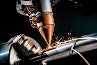 Direct Metal Deposition via Powder Nozzle