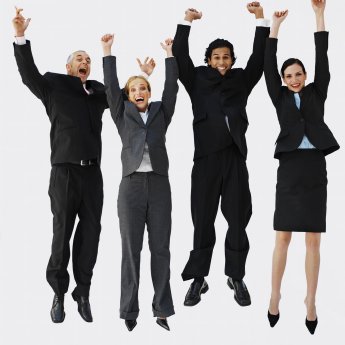 Front view portrait of four business executives jumping with arms.JPG
