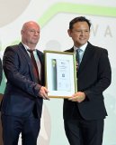 Mr. Bernd Herrmann, Chief Financial Officer of TÜV SÜD Global Product Service (in the picture in the middle), receives the EuroCham Sustainability Award 2025 from Senior Minister of State for Defence and Sustainability and the Environment, Mr. Zaqy Mohamad (right)