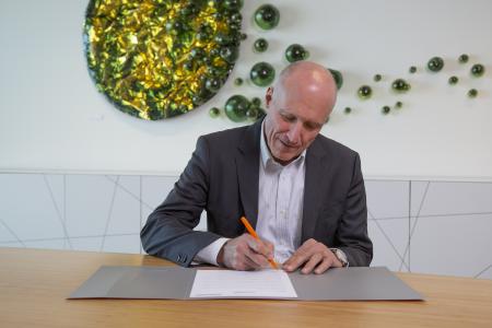 CEO Remo Brunschwiler signing the Climate Pledge HR