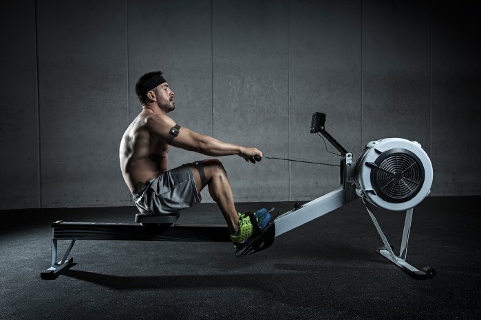 GYMWATCH - Man with Rowing Machine and Sensor duo.png