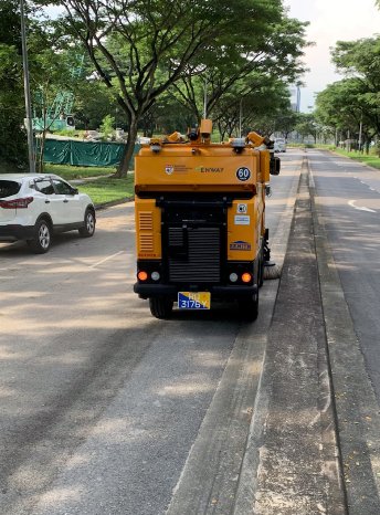 Autonomous road sweeper shares the street with other road users.jpg