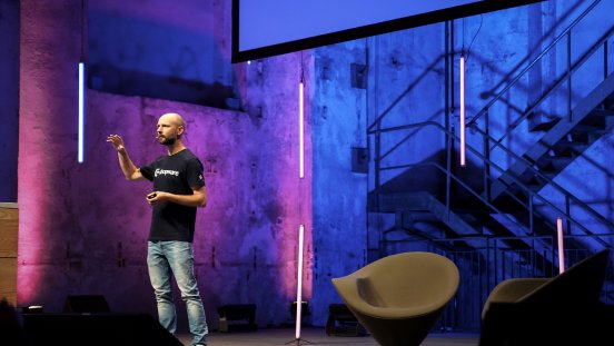 Shopware Co-CEO Sebastian Hamann on stage.jpeg