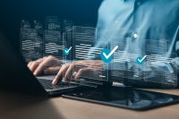 Businessman filling out digital document