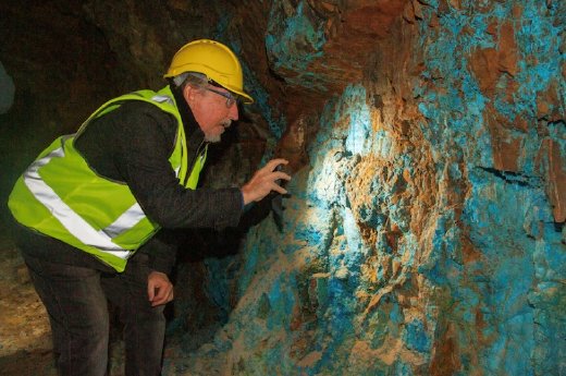 First Tin - Tony Truelove technical director examining copper azurite mineralisation - the blue.jpg