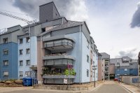 Zeitgemäße Gestaltung, die den ursprünglichen Charakter der Gebäude erhält: In der Kaiserslauterner Steinstraße haben sechs Mehrfamilienhäuser ein neues Gesicht erhalten. Foto: Caparol Farben Lacke Bautenschutz/Martin Duckek 