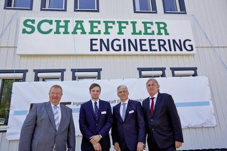 Christian Degenhardt, founder and former managing director of IFT Ingenieurgesellschaft für Triebwerkstechnik mbH, Christopher Lehne, Rolf Laufs (both Schaeffler Engineering), and Prof. Dr.-Ing. Peter Gutzmer, Deputy CEO and Chief Technology Officer at Schaeffler AG (left to right) unveiled the new company sign symbolizing the merger of Schaeffler Engineering and IFT at the company's main building in Clausthal-Zellerfeld. Image: Schaeffler Engineering
