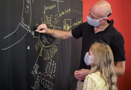HeiQ co-founder and group CEO Carlo Centonze explains the mechanism of HeiQ Viroblock to his daughter. (Photo from HeiQ)