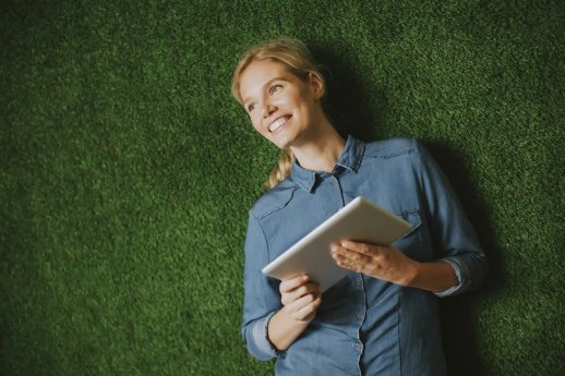 pretty-young-woman-with-tablet-by-green-wall-2048x1365.jpg.webp