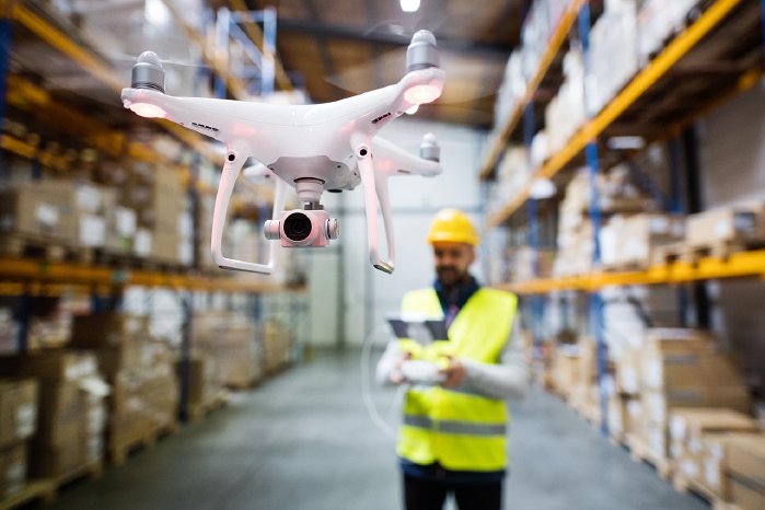 man-with-drone-in-a-warehouse-PX5D8YB.jpg