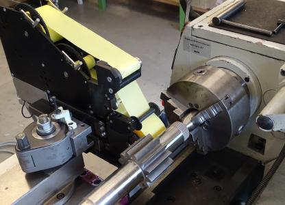 Thielenhaus Microfinish’s attachments represent a cost-efficient opportunity to machine small batch sizes with finish tapes and stone tools using the base machines that you already own.
