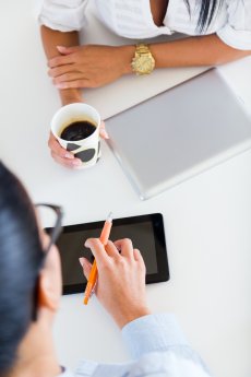 two-business-woman-working-office-with-digital-tablet.jpg