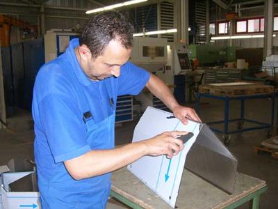Removing the protective foil from a work piece of stainless steel.