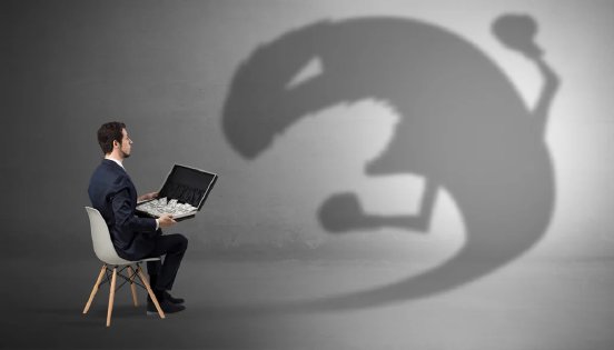 man-with-money-in-case-and-ominous-shadow-1-1030x588.webp
