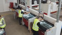 Industrial laser production environment with multiple machines in operation