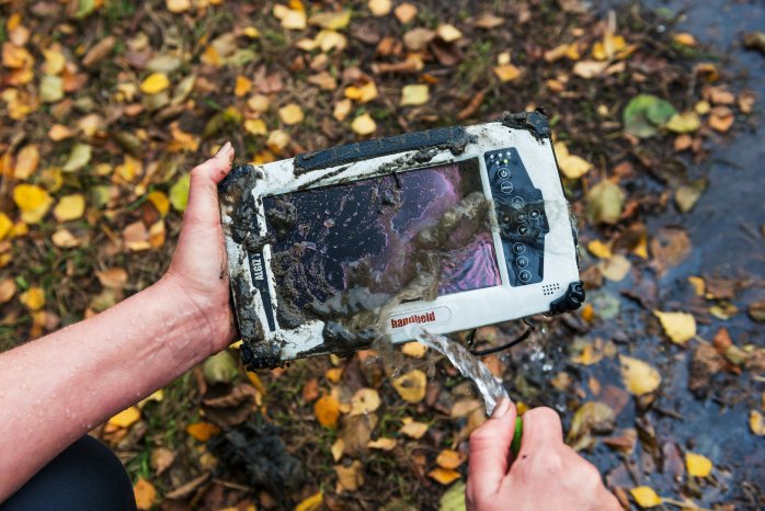 Algiz-7-handheld-rugged-tablet-outdoors-in-mud-and-water.jpg