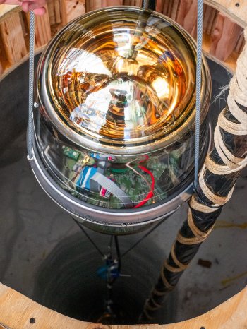 Aya Ishihara IceCube_NSF_A D Egg is lowered into a borehole June 2026 P1040671_300dpi.jpg