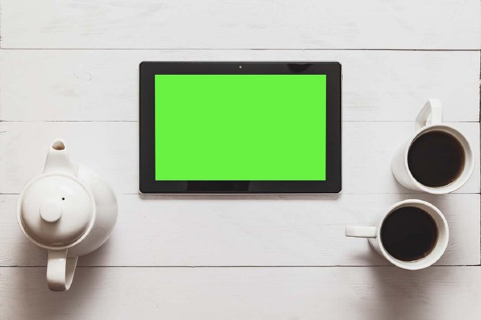 black-tablet-with-blank-green-screen-and-hot-tea-t-PGMRPX4.jpg