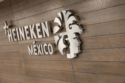 The logo depicts the two famous Aztec emperors and namesakes of the brewery Cuauhtémoc and Moctezuma in profile.