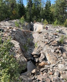 Photo 2 80m long trench on the Rivard Property, looking back along the strike of a gold-bearing vein