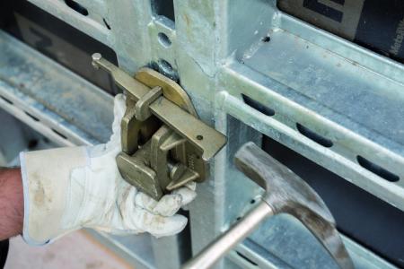 Fastening the swivel bearing that holds the tapering tie rod end on a NOEtop large area panel.