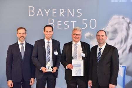 Dr. Christian Eschner (PSP), Christian Lang und Ralf Bernhardt (FIS) sowie Staatsminister Aiwanger bei der Preisverleihung