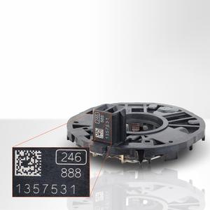 Laser-marked Data Matrix code on automotive plastic device.