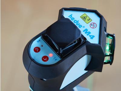 Nivellieren mit drei grünen 360°-Laserlinien.