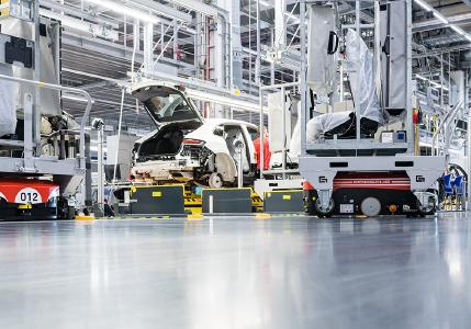 Grenzebach L1200S AGVs deliver seats just-in-sequence and with high precision for the assembly into the corresponding sports cars. Credit: Porsche Leipzig GmbH