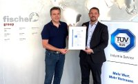 Dr Thomas Gallinger from TÜV SÜD presents the certificate to Hans-Peter Fischer, CEO of fischer group. Picture: fischer group