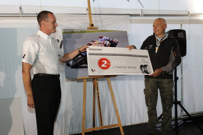 Second placed photographer Friedrich Weisse being presented his prize by Bridgestone Europe Sout.jpg