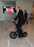 Prof. Dr.-Ing. Tim Hosenfeldt, Senior Vice President Technology Strategy & Innovation at Schaeffler AG, tests one of the business ideas presented, the Steereon electric scooter from PLEV Technologies GmbH (Photo: Schaeffler)