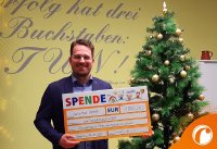 Thomas Brand, Geschäftsführer der Solvimus GmbH mit dem Scheck für das Kinderhospiz