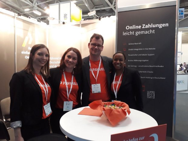 PAYMILL Team am Messestand.JPG