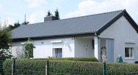 Ansehnliche Metalldachpfannen vom Typ LM D-TILE ersetzen Faserzementplatten