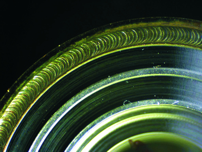 With the help of the TOLAS 1 by arteos, perfect welding seams can be achieved. The photo shows a 25 µm thin titanium foil that was welded to a titanium ring.