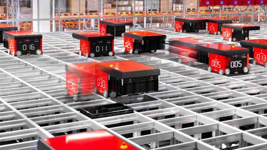 Dematic hat im Siemens-Werk für Kombinationstechnik in Chemnitz (Siemens WKC) eine AutoStore®-Anlage mit mehr als 45.000 Behältern installiert. Die Zusammenstellung der Aufträge übernehmen 34 Roboter. (Foto: Dematic/Gerd Knehr)