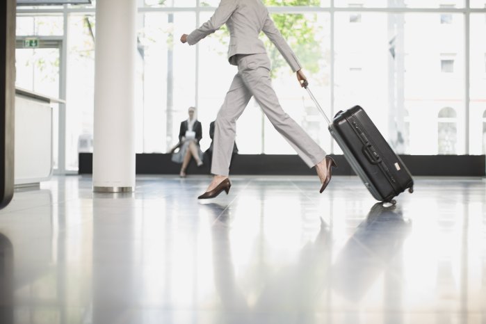 woman-pulling-luggage-through-airport-5500 x3667.jpg