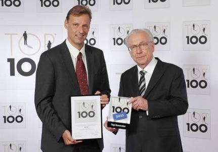 MID Managing Director Jochen Seemann (Left) Receives The Top 100 Award from Lothar Späth (Right).