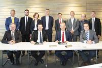 The TenneT and arvato Systems team during the signing of the contract     