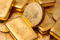 Goldbarren und Goldmünzen / Foto: AdobeStock