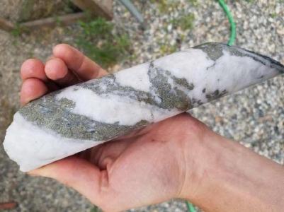 Photo of piece of NQ drill core from Hole 2019-31 containing coarse pyrite mineralization.
