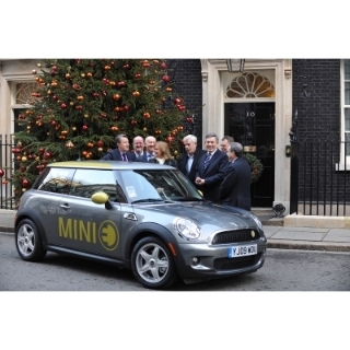 Prime Minister Gordon Brown and Business Secretary Lord Mandelson welcome the first all-electric vehicle - a MINI E - to be used in the Government car pool for Ministerial business around London